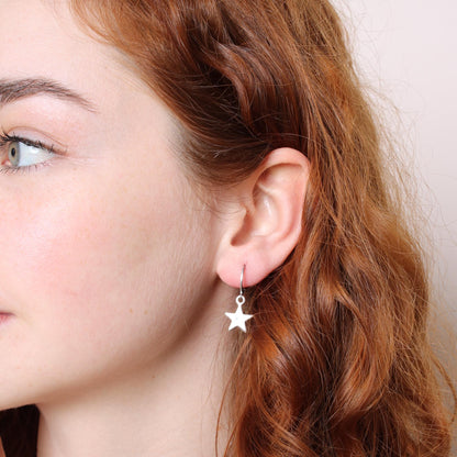 30E3112 - Star Huggie Hoops, Silver