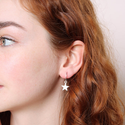 30E3112 - Star Huggie Hoops, Silver