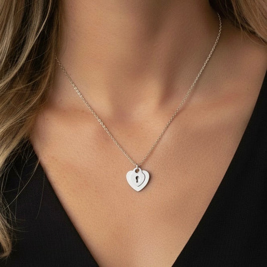 Silver double heart necklace with keyhole detail in stainless steel – waterproof & tarnish-free.